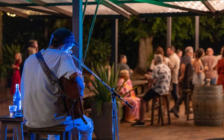 man playing guitar at event 